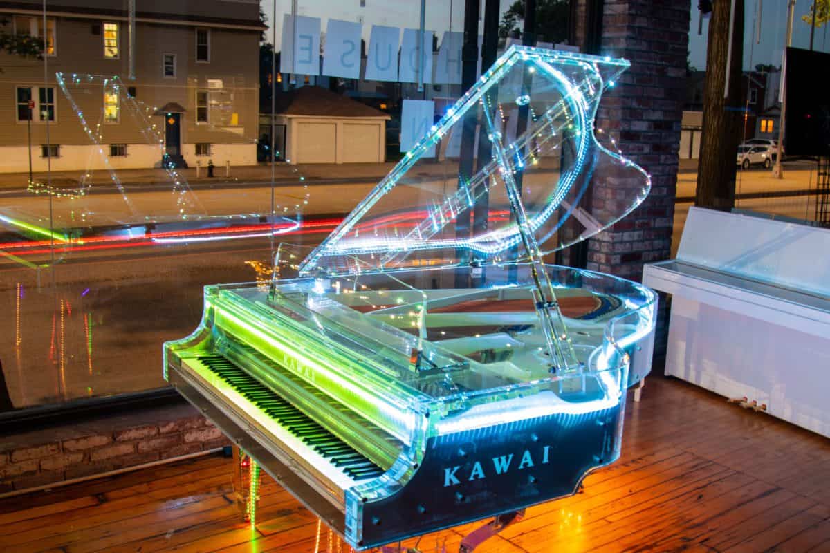 Playing A Clear Grand Piano Made of Transparent Acrylic